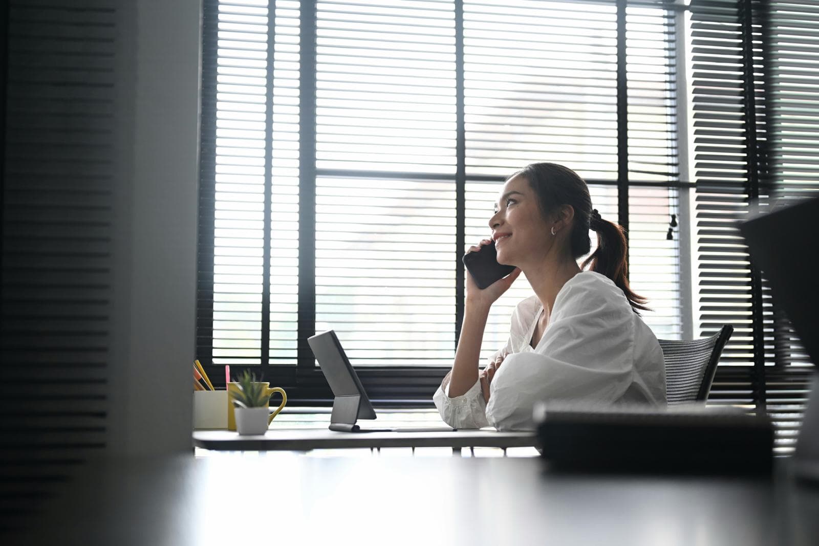 Business professional using modern VoIP phone system